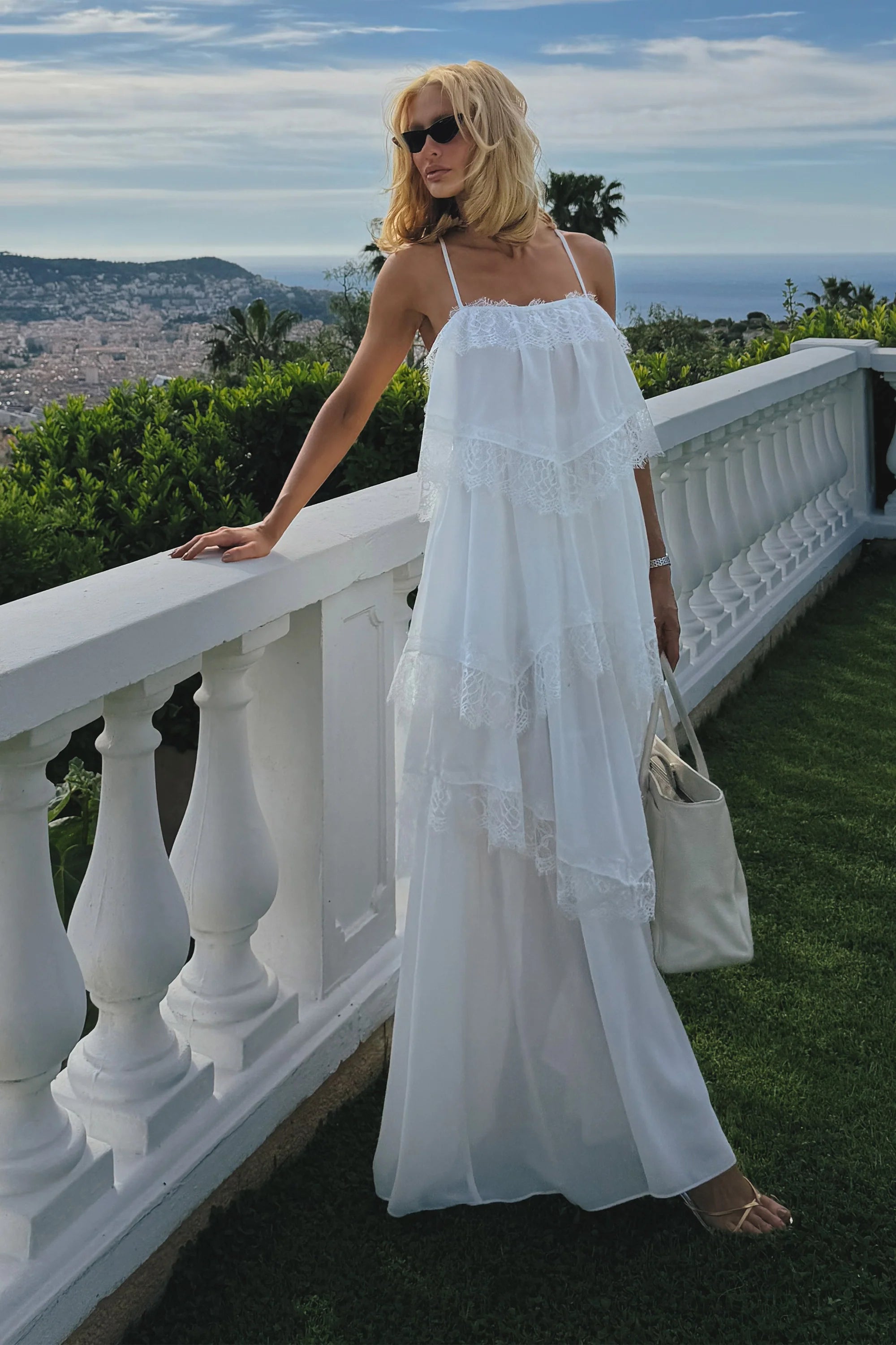 Off-white midi dress with ruffles and lace hem detail