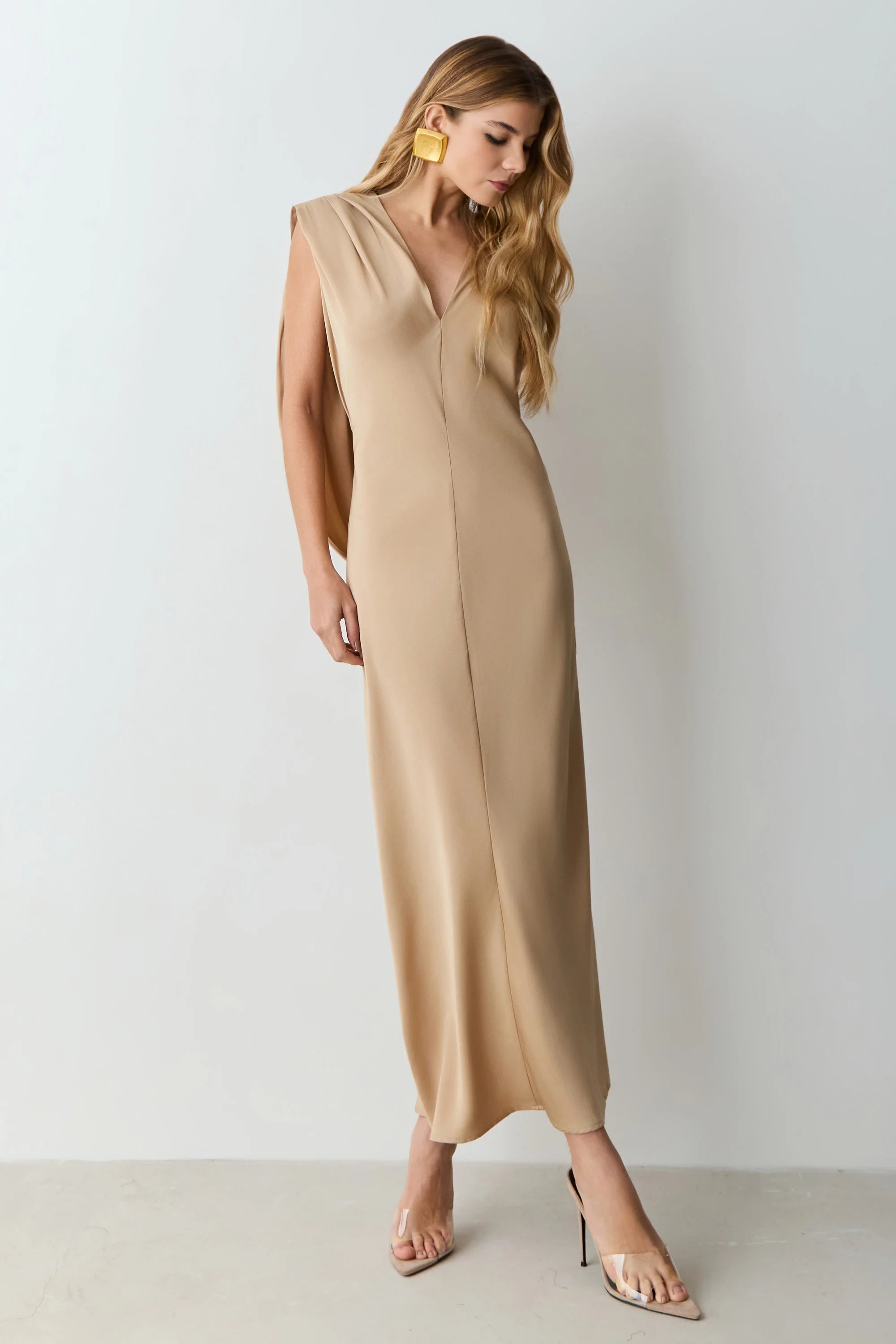 Khaki V-neck midi dress with shoulder pads and back detailing.